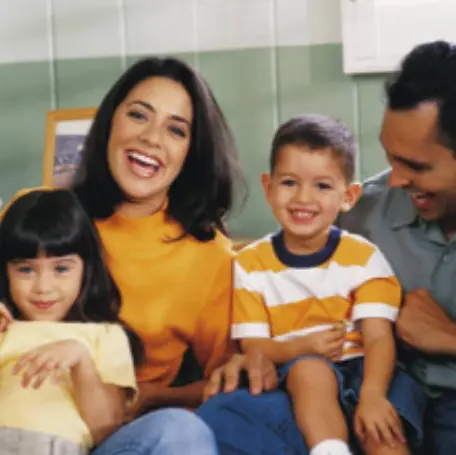 Parents smiling with two early childhood students