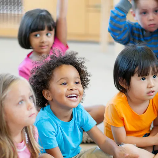 Elementary students laughing in classroom